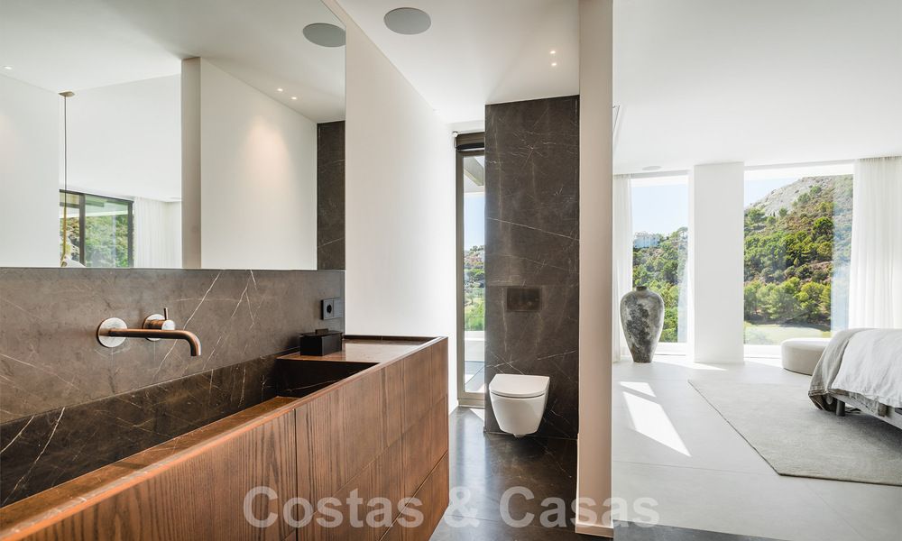 Luxueuze designervilla te koop in exclusief, gated frontlinie-golfcomplex met panoramisch uitzicht in La Quinta, Marbella - Benahavis 59084