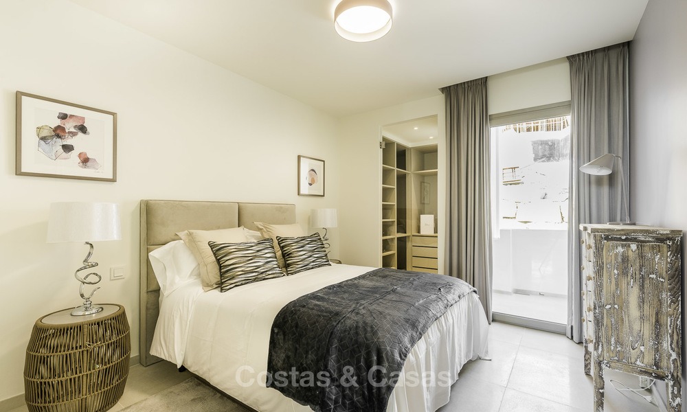 Luxe appartementen te koop in een exclusief complex in Nueva Andalucia - Marbella met panoramisch uitzicht over de golf en zee 12471