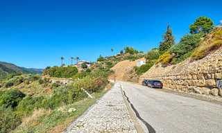 Te koop: groot bouwperceel met panoramisch zee- en bergzicht op een luxe landgoed in Benahavis, Marbella 7205 