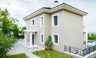 Nieuwbouw villa te koop in een hedendaagse klassieke stijl met zeezicht in vijfsterren golfresort in Marbella - Benahavis 34929 