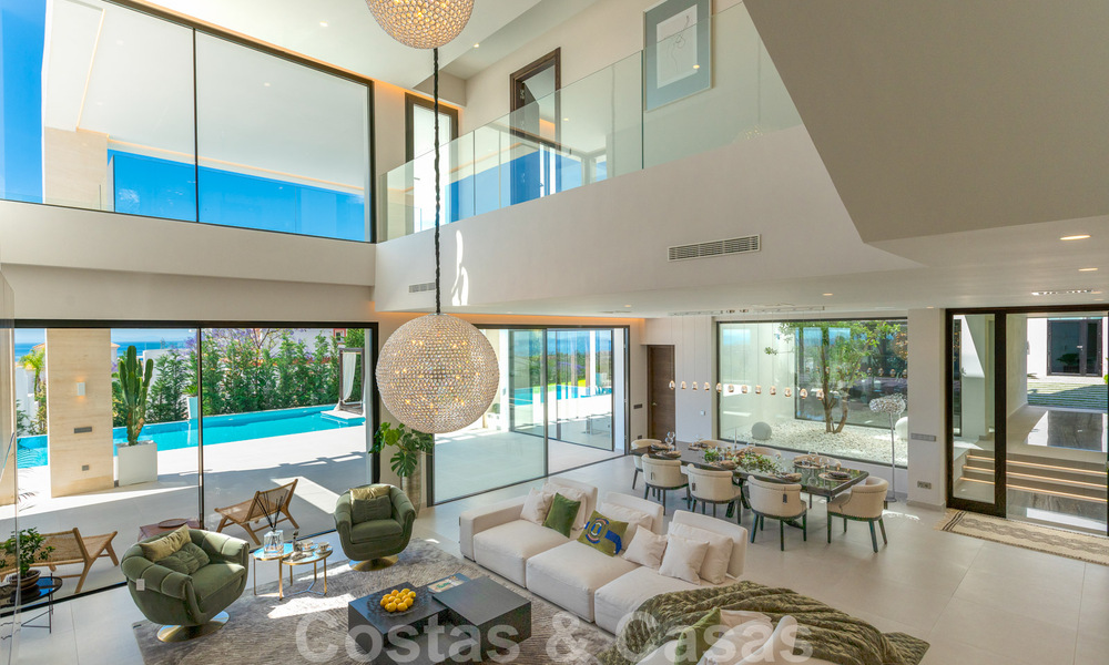 Instapklare, nieuwe moderne villa te koop met zeezicht vanaf ieder niveau in een vijfsterren golfresort in Marbella - Benahavis 35735