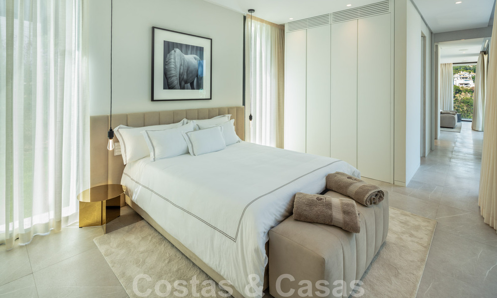 Sensationele nieuwe moderne luxevilla te koop met zeezicht in “gated” El Madroñal in het gebied van Marbella - Benahavis 35928