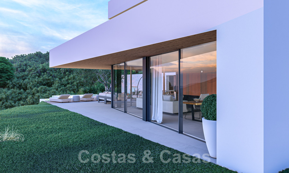 Moderne villa te koop in een natuurlijke omgeving, met panoramisch uitzicht op de vallei en de zee, in een gated resort in Benahavis - Marbella 40515