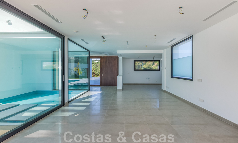 Nieuwe, eigentijdse villa te koop met open uitzicht op de golfbanen van het begeerde golfresort La Cala Golf, Mijas 44644