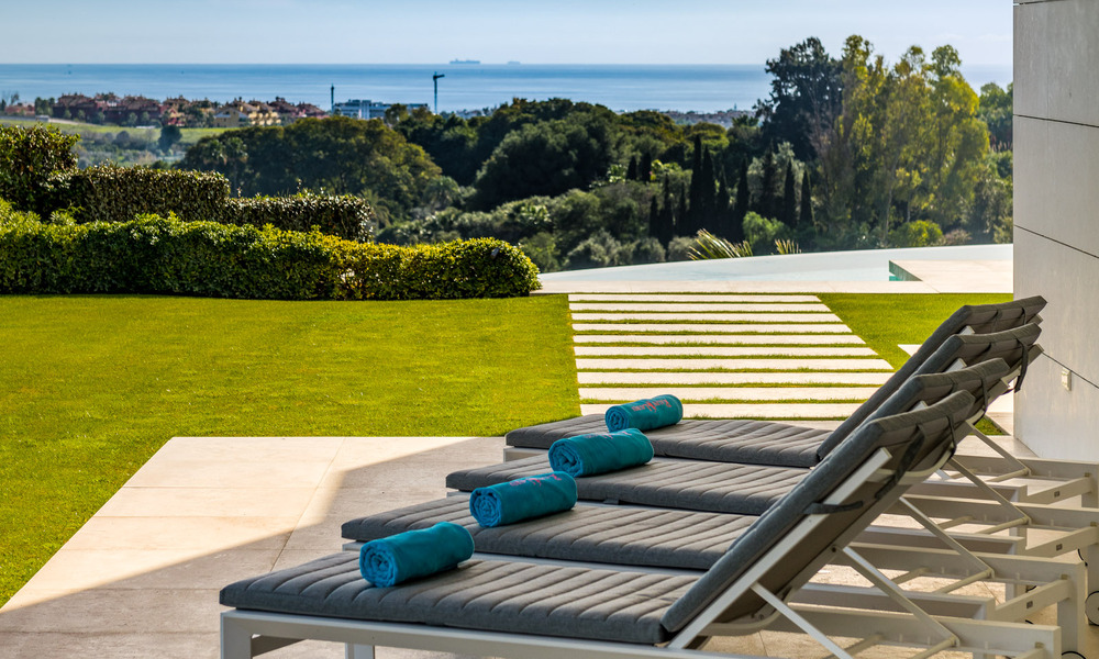 Eerstelijns golf luxevilla in een elegante moderne stijl met prachtig golf- en zeezicht te koop in Los Flamingos Golfresort in Marbella - Benahavis 48949