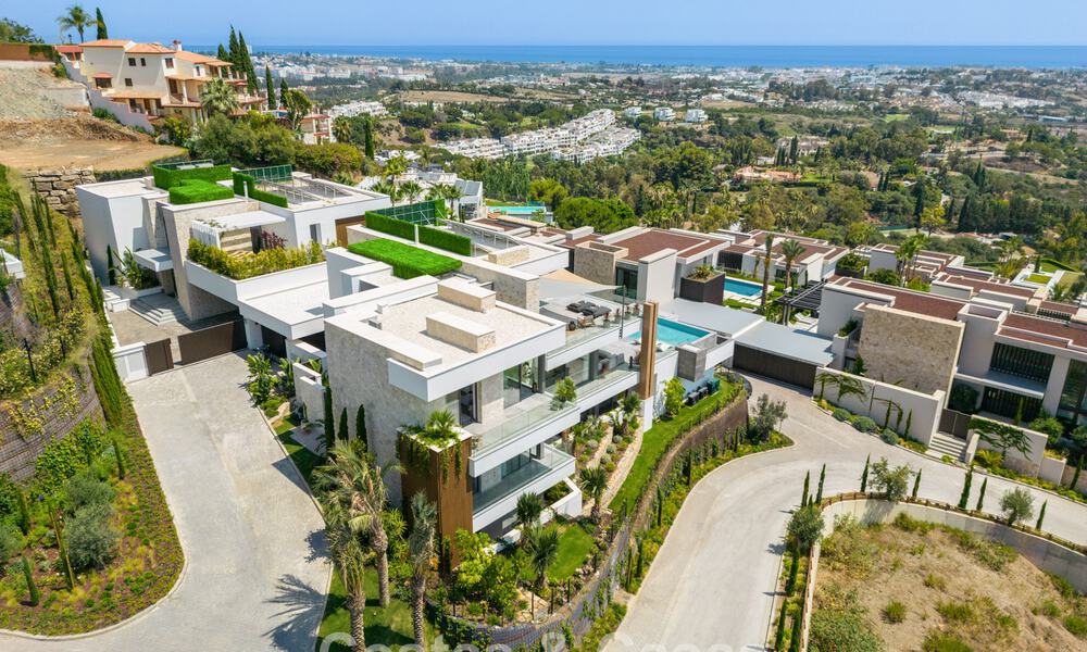 Verbluffende, architecturale luxevilla te koop met open zeezicht in een hoogstaande gated woonwijk in de heuvels van La Quinta in Marbella - Benahavis 54126