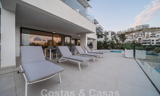 Luxueus, modern, begane grond appartement te koop met verwarmd privézwembad en zeezicht in Marbella - Benahavis 55646 