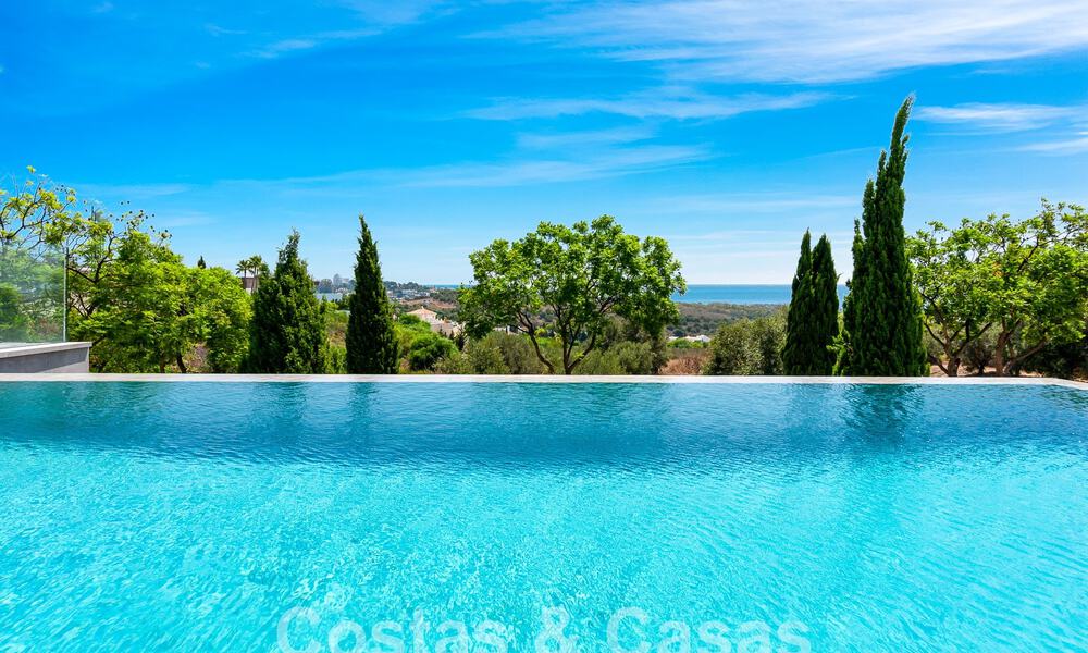 Nieuwe, modernistische designervilla te koop met prachtig zeezicht in vijfsterren golfresort te Marbella - Benahavis 55823