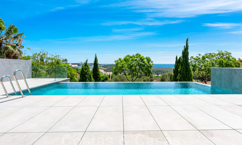 Nieuwe, modernistische designervilla te koop met prachtig zeezicht in vijfsterren golfresort te Marbella - Benahavis 55892