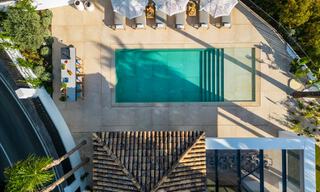 Moderne Andalusische luxevilla met onbelemmerd zeezicht te koop in een beveiligde wijk in La Quinta, Marbella - Benahavis 59528 