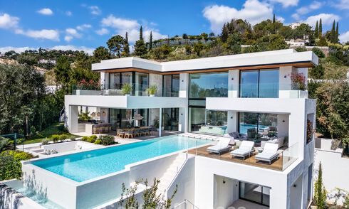 Gesofisticeerde, nieuwe luxevilla met panoramisch zeezicht te koop in een gated community van La Quinta, Marbella - Benahavis 800549
