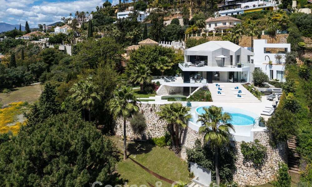 Avant-garde desginervilla met panoramisch zeezicht te koop in een gated community in Benahavis - Marbella 780010